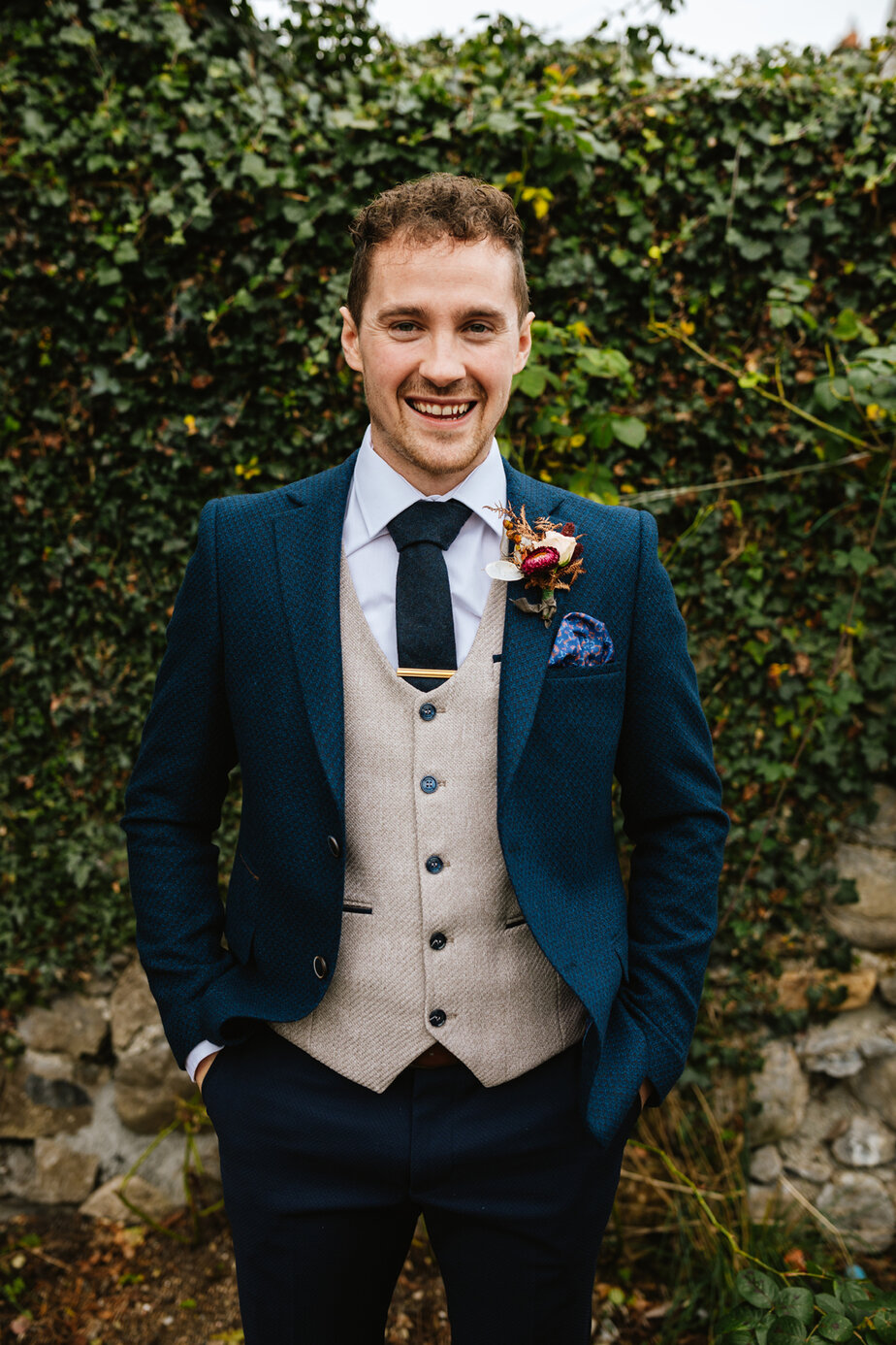 Man close up suit flower tie