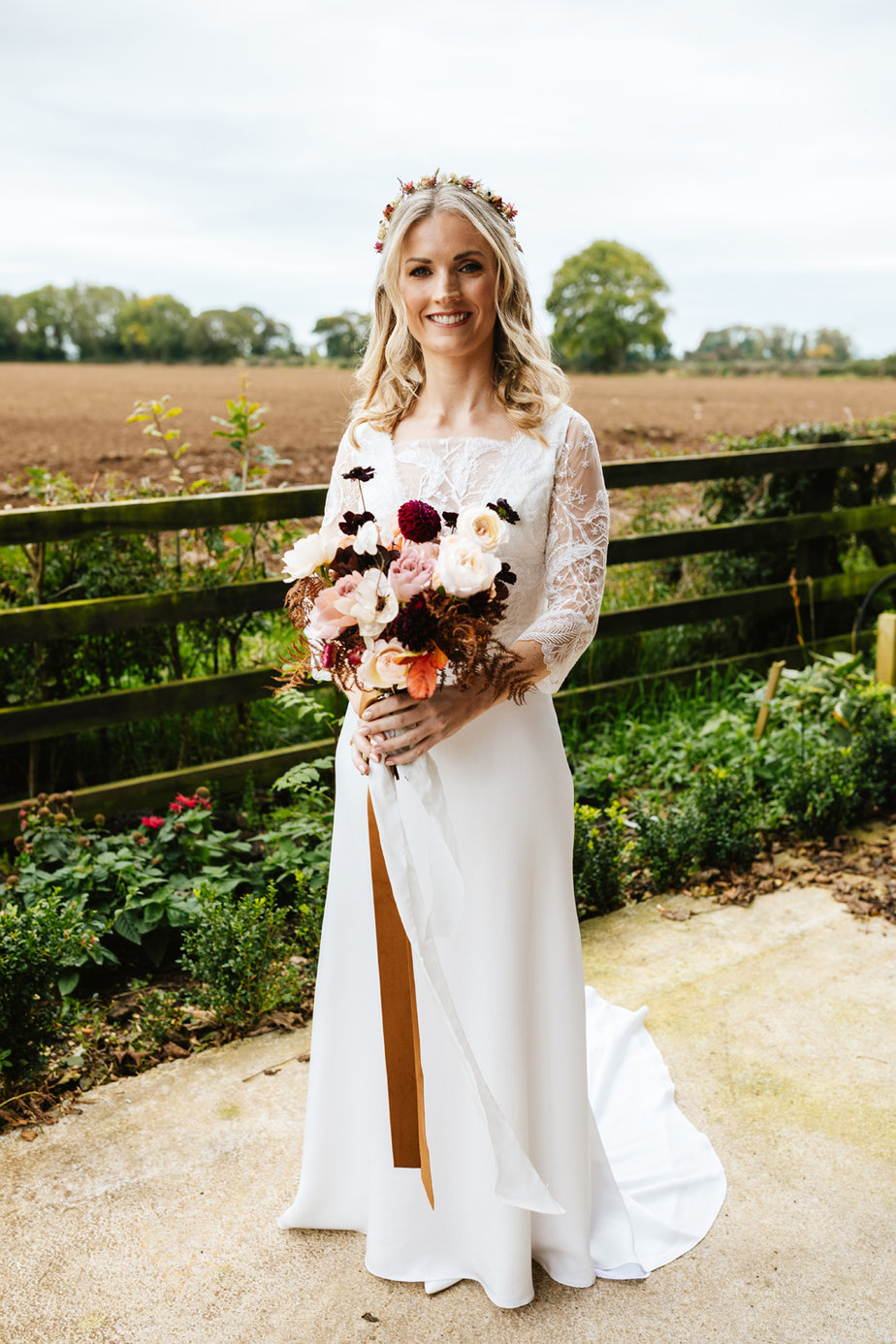 Bride holding pink white flowers roses bouquet