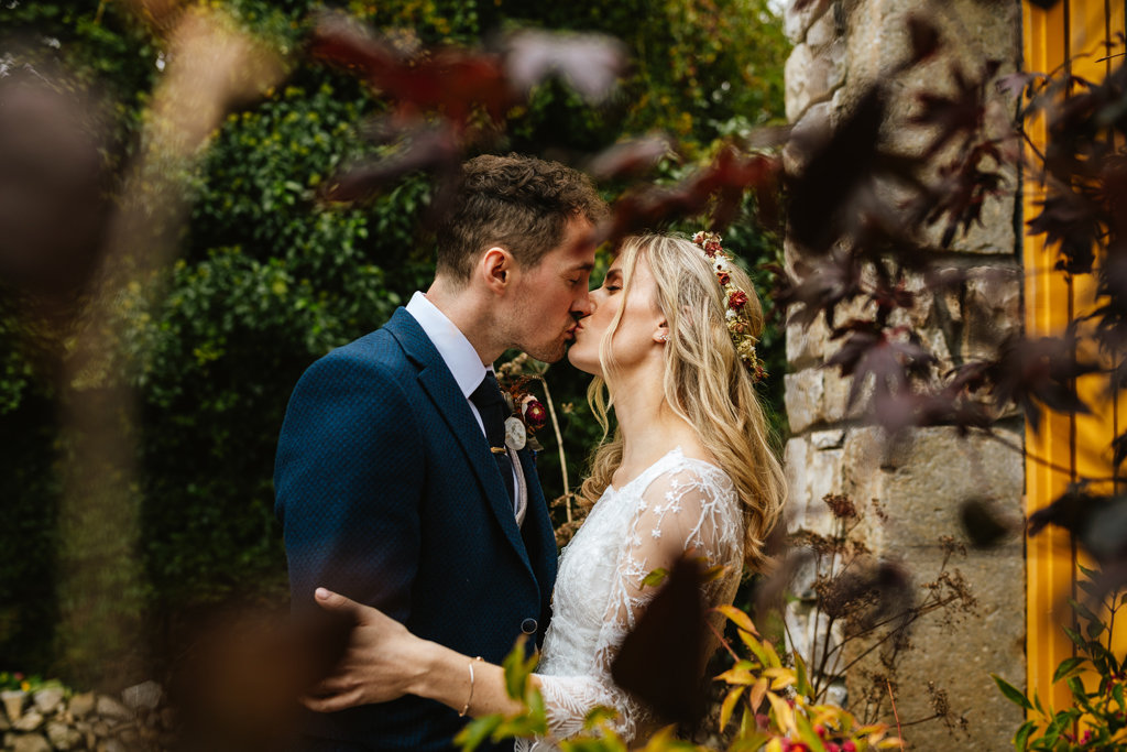 Bride groom autumnal kissing