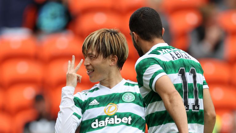 Celtic's Kyogo Furuhashi (left) celebrates scoring their side's third goal of the game, completing a hat-trick during the cinch Premiership match at Tannadice Park, Dundee. Picture date: Sunday August 28, 2022.
