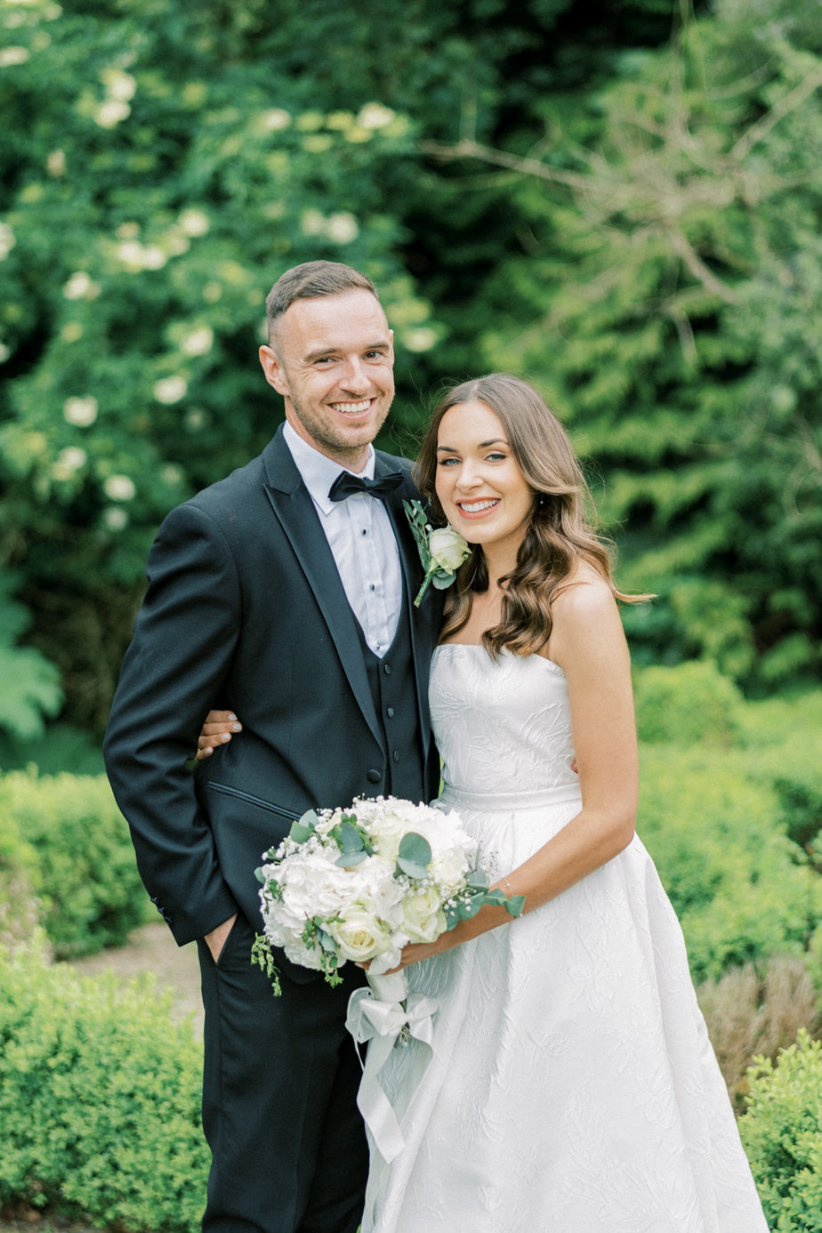 Bride groom white flower bouquet exterior garden