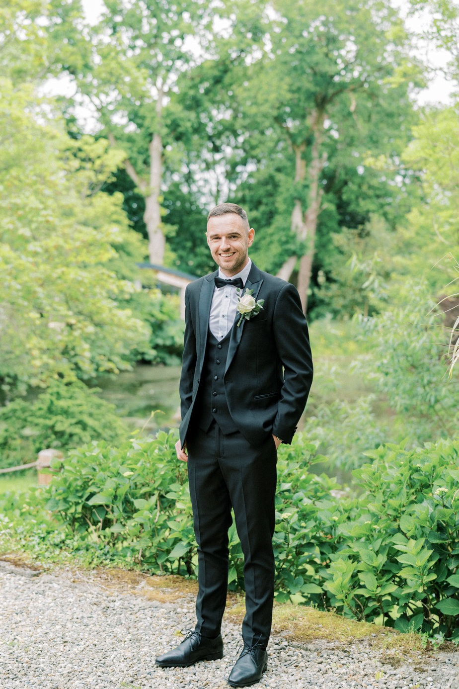 Groom suit jacket getting ready