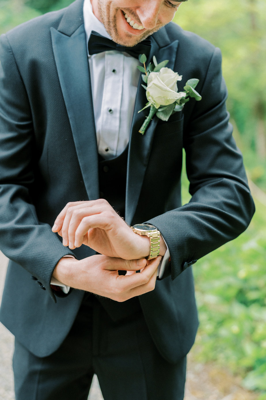 Groom suit jacket getting ready close up flower