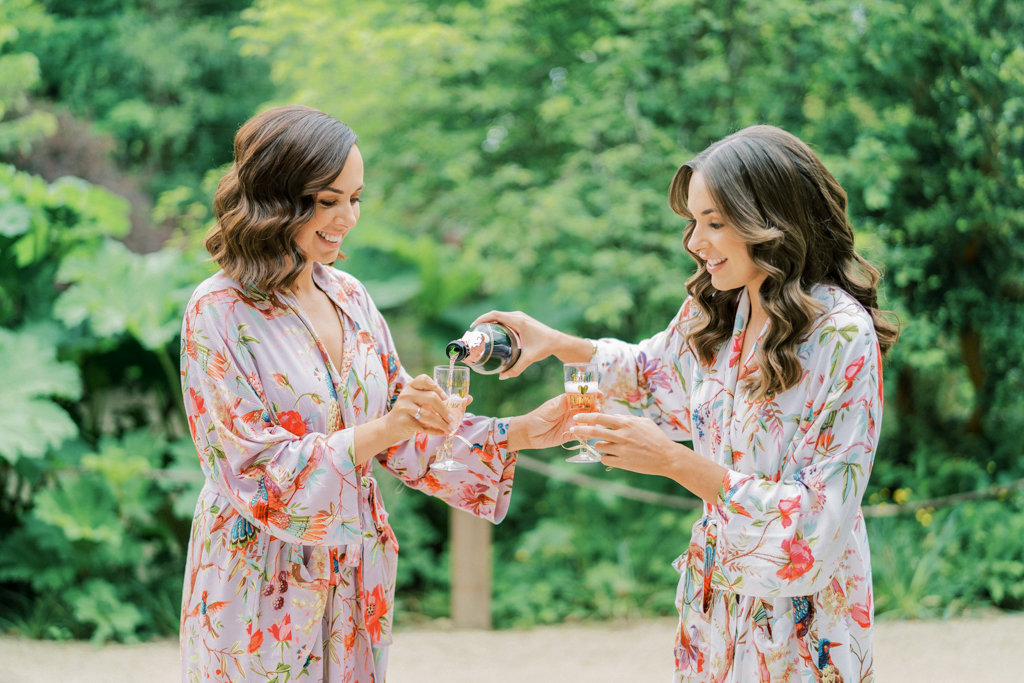 Bride hairstyle bridesmaid before ceremony cheers prosecco wine champagne
