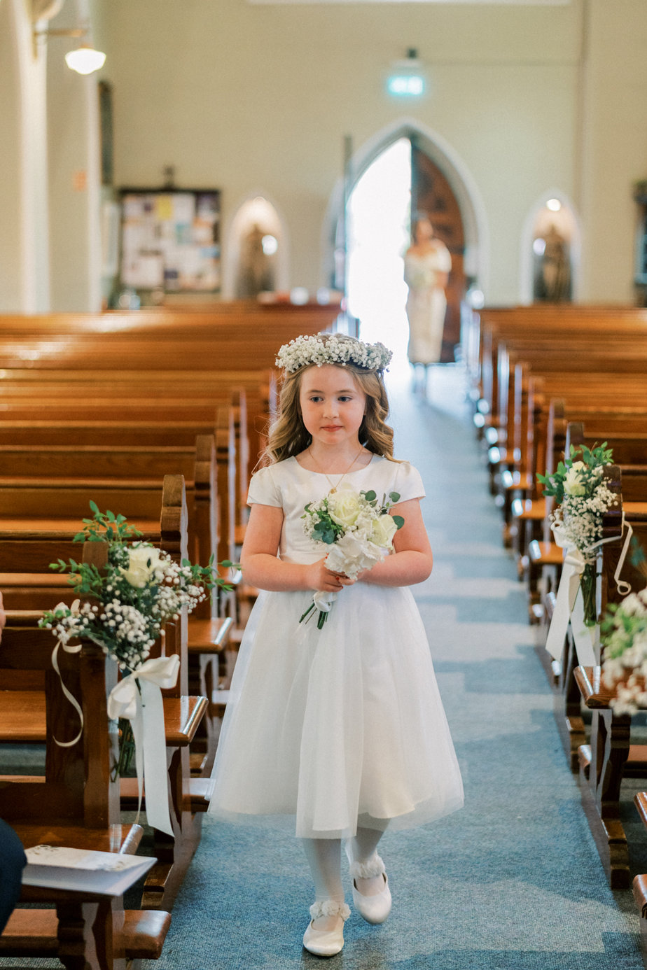 Flower girl aisle pews church