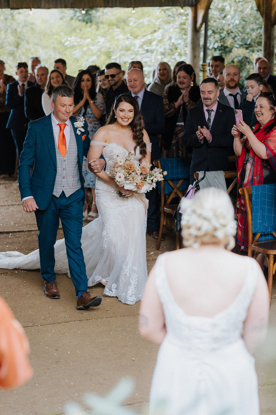Father of the bride walks up aisle