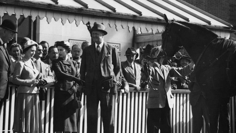 The Queen points to her colt Doutelle, who had just won the 2,000 Guineas Trial Stakes at Kempton Park