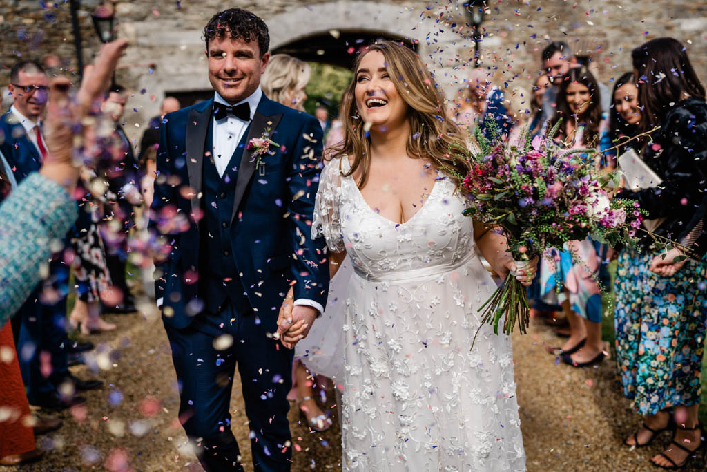 Confetti on bride and groom leaving ceremony