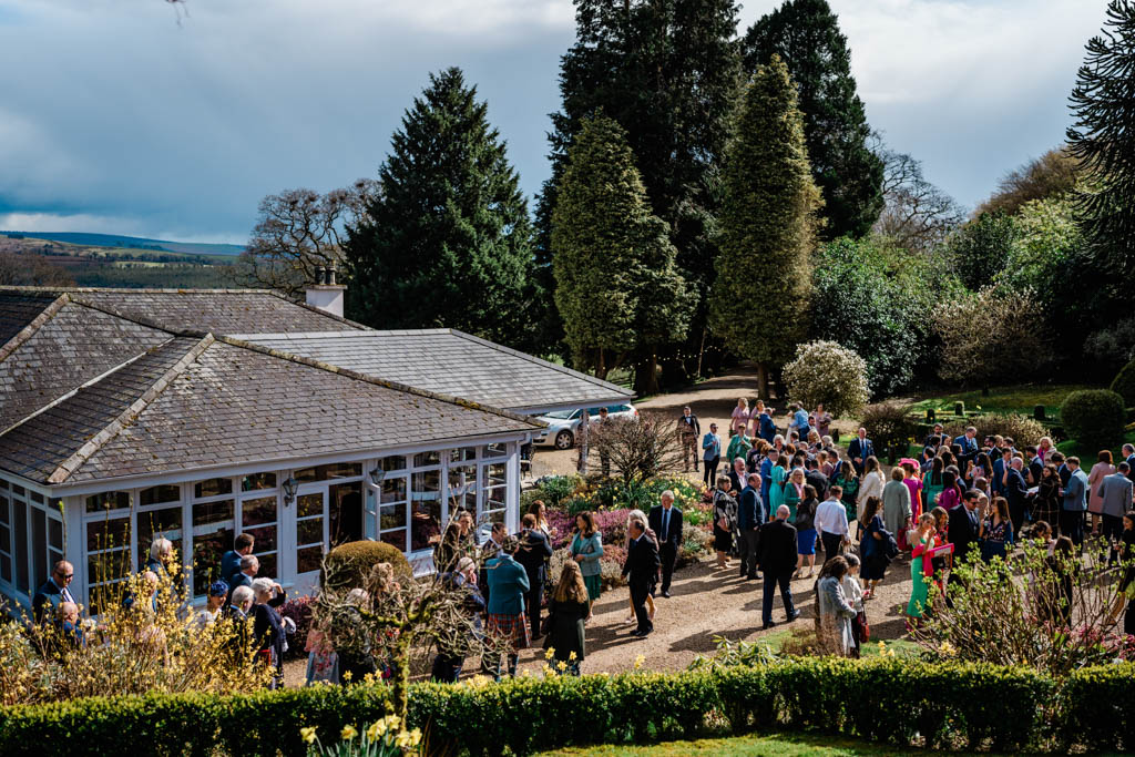 Exterior wedding venue and guests