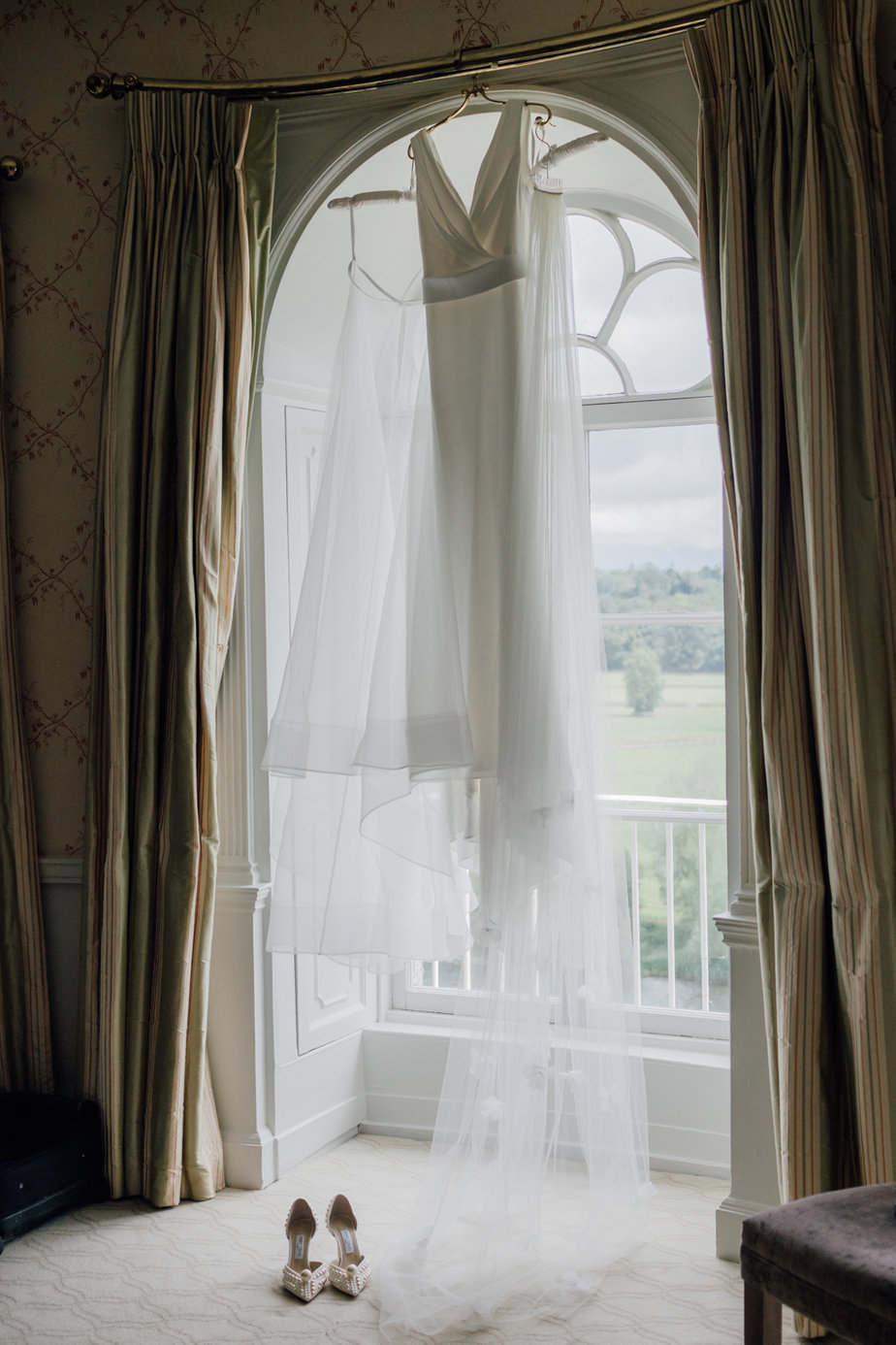 dress hanging from window 