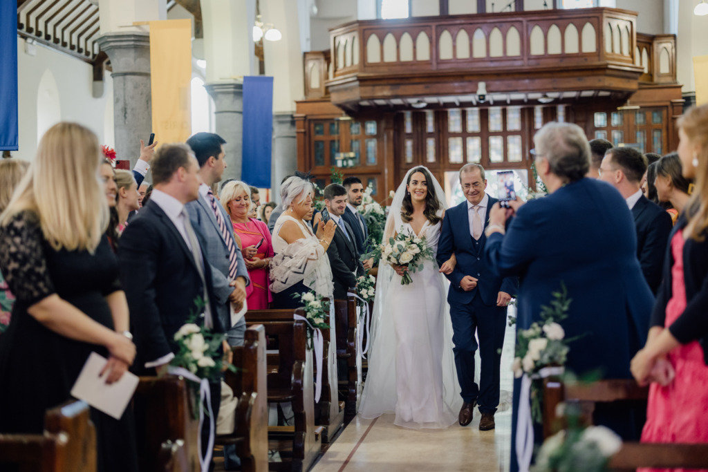 father walking bride up aisle