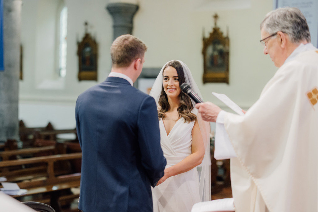 bride and groom at altar 