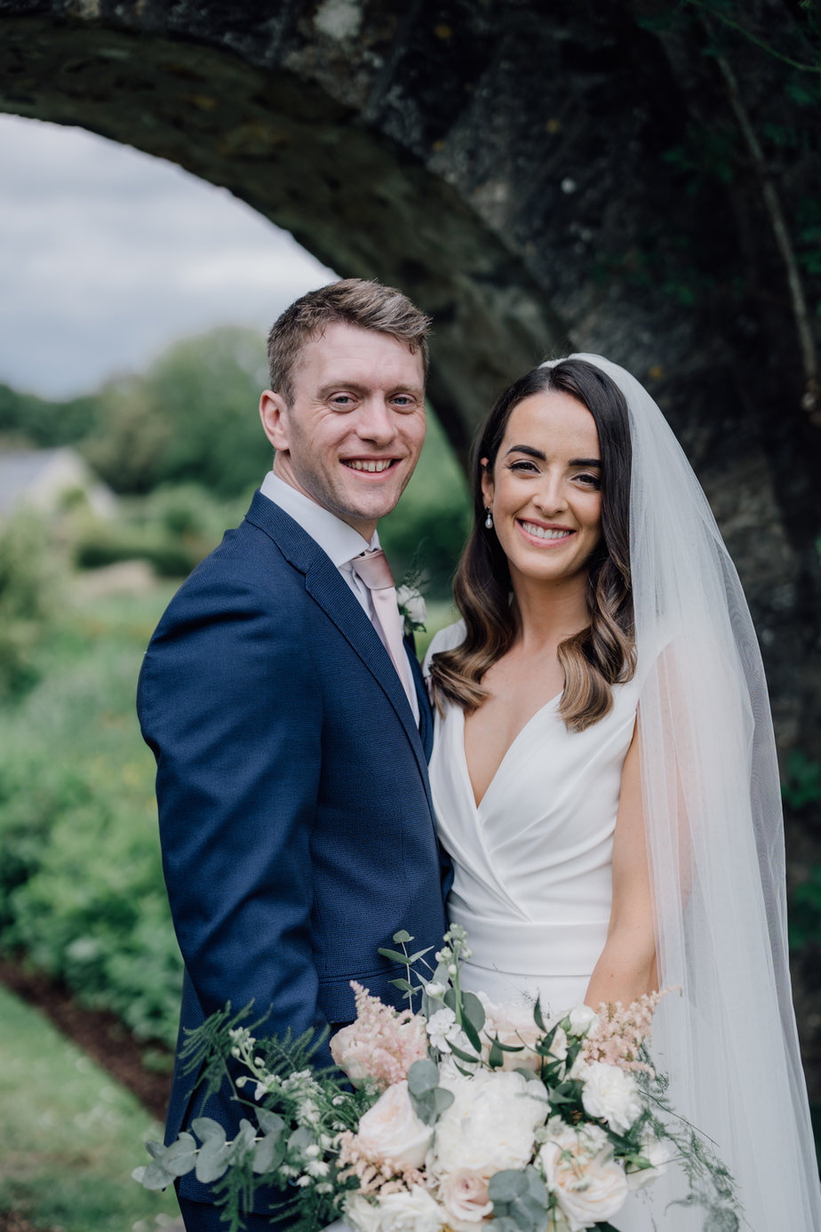 bride and groom smiling 