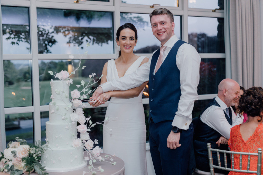  bride and groom cut the cake 