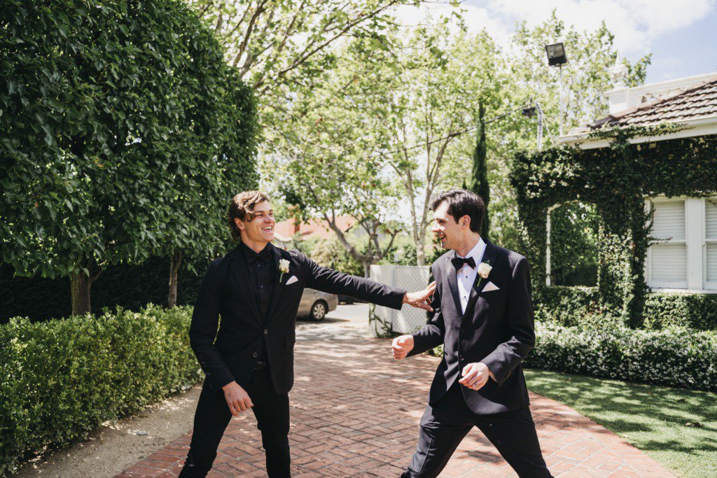 Groom and groomsman black suits