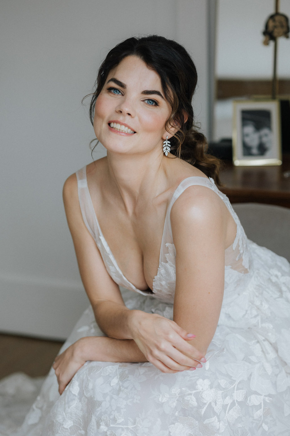 Bride smiling sitting down