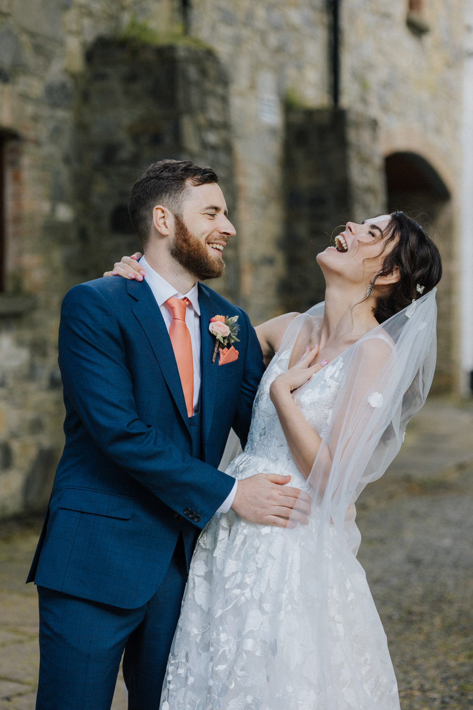 Bride and groom laughing laugh