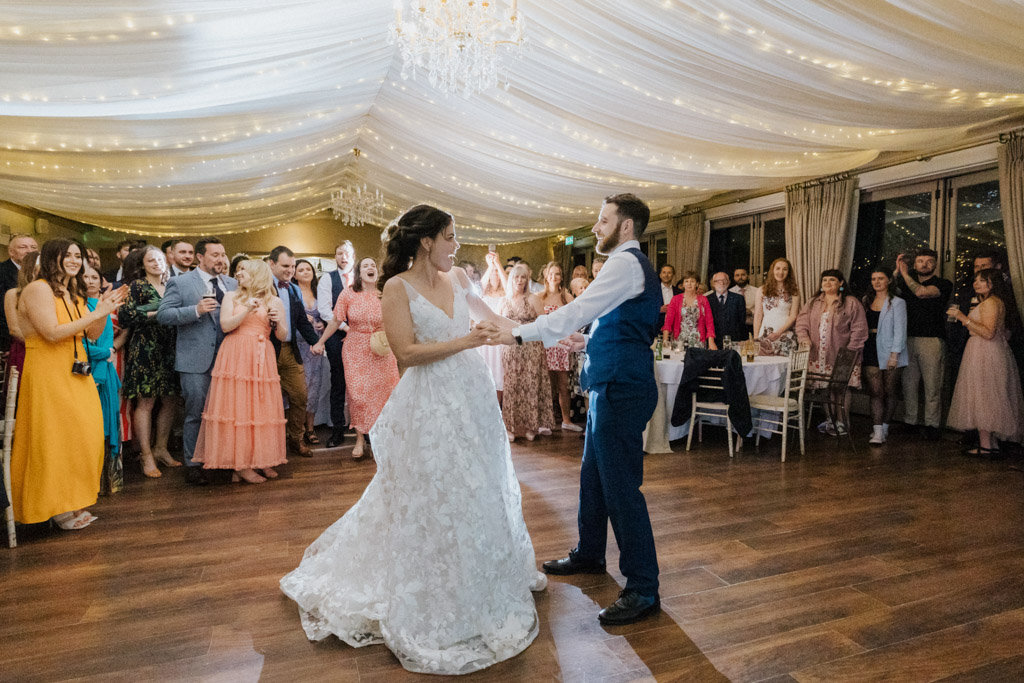 Bride and groom dancing on dancefloor