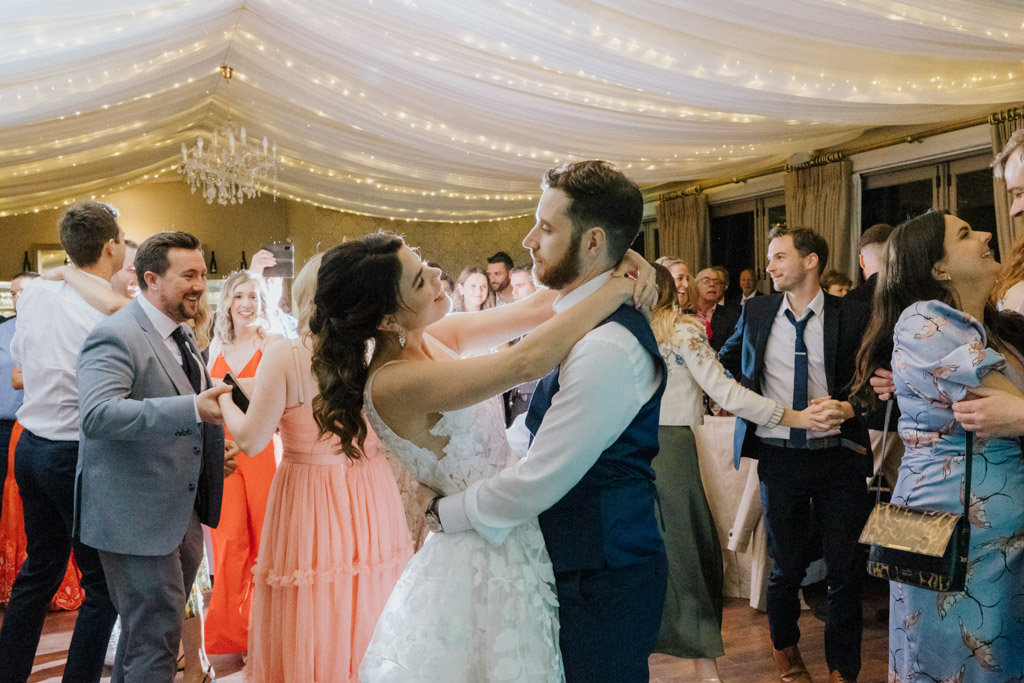 Bride and groom dancing on dancefloor