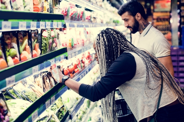 A couple grocery shopping together