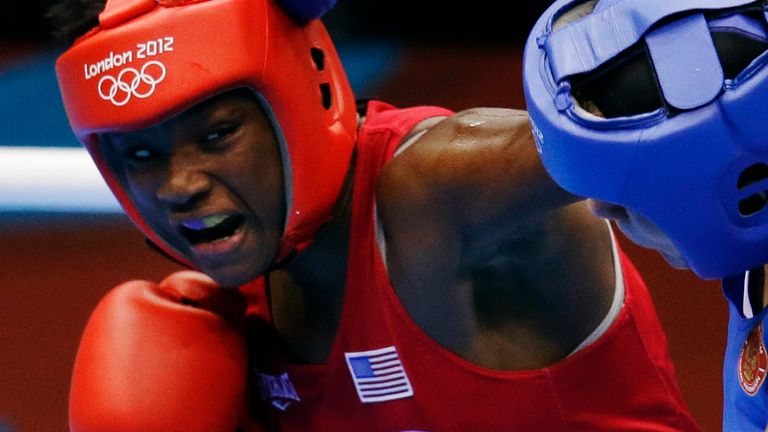 United States' Claressa Shields RED fights Russia's Nadezda Torlopova BLUE in a women's middleweight 75-kg boxing gold medal match at the 2012 Summer Olympics, Thursday, Aug. 9, 2012, in London. (AP Photo/Patrick Semansky)