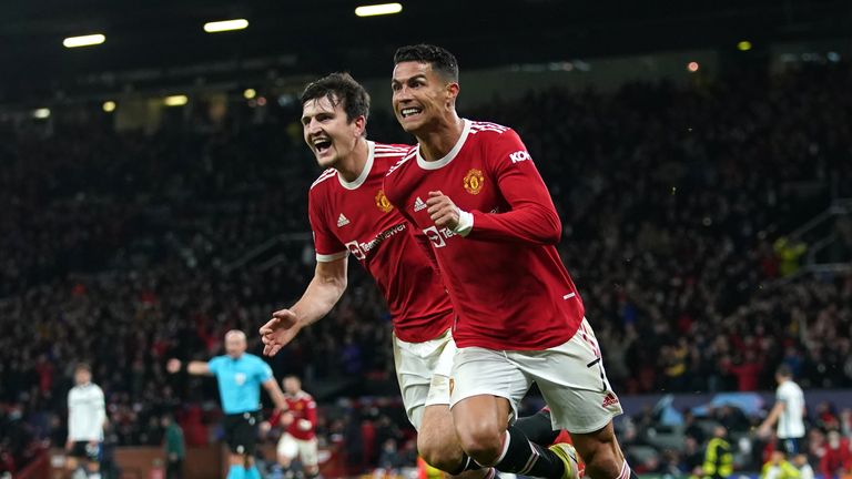 Manchester United's Cristiano Ronaldo (right) celebrates scoring their side's third goal of the game with Harry Maguire during the UEFA Champions League, Group F match at Old Trafford, Manchester. Picture date: Wednesday October 20, 2021.