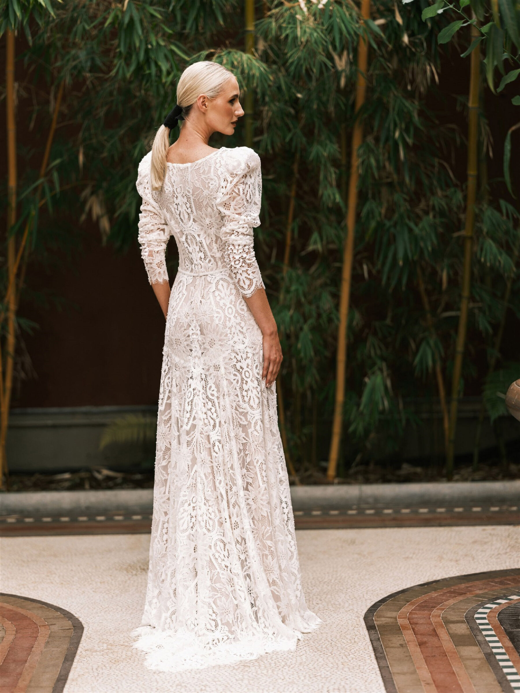 Katya Katya London lace wedding dress. Bridal ponytail.