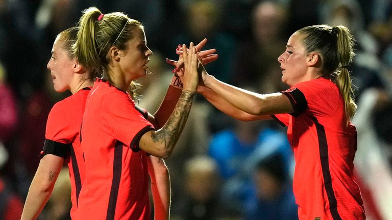 England's Ella Toone, right, celebrates after scoring her side's third goal against Japan