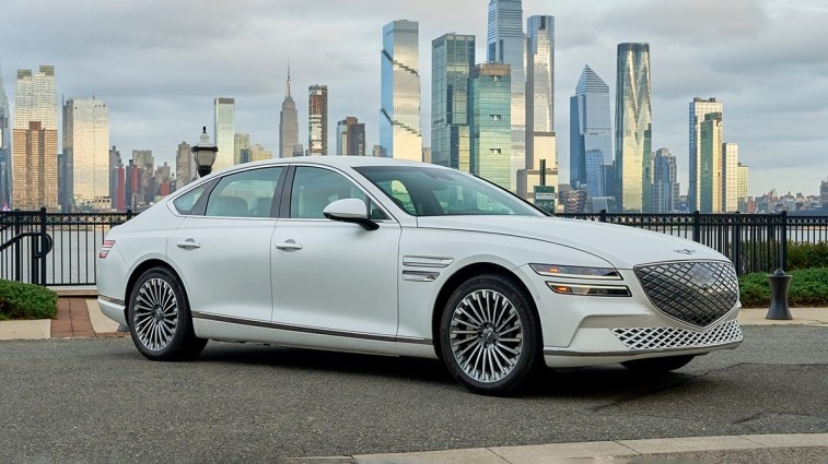 2024 Genesis Electrified G80 in white parked outside.
