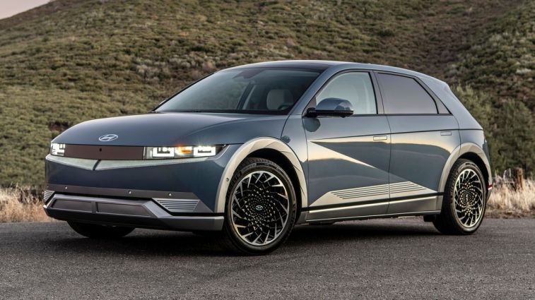 2024 Hyundai Ioniq 5 with green hills in the background.