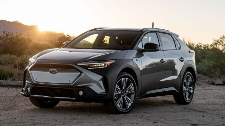 2024 Subaru Solterra in the desert at sunset.
