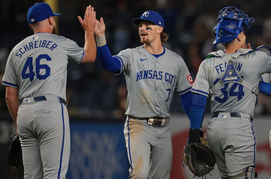 Sep 10, 2024; Bronx, New York, USA; Kansas City Royals shortstop Bobby Witt Jr. (7) and relief pitcher John Schreiber (46) celebrate after defeating the New York Yankees at Yankee Stadium. Mandatory Credit: Vincent Carchietta-Imagn Images