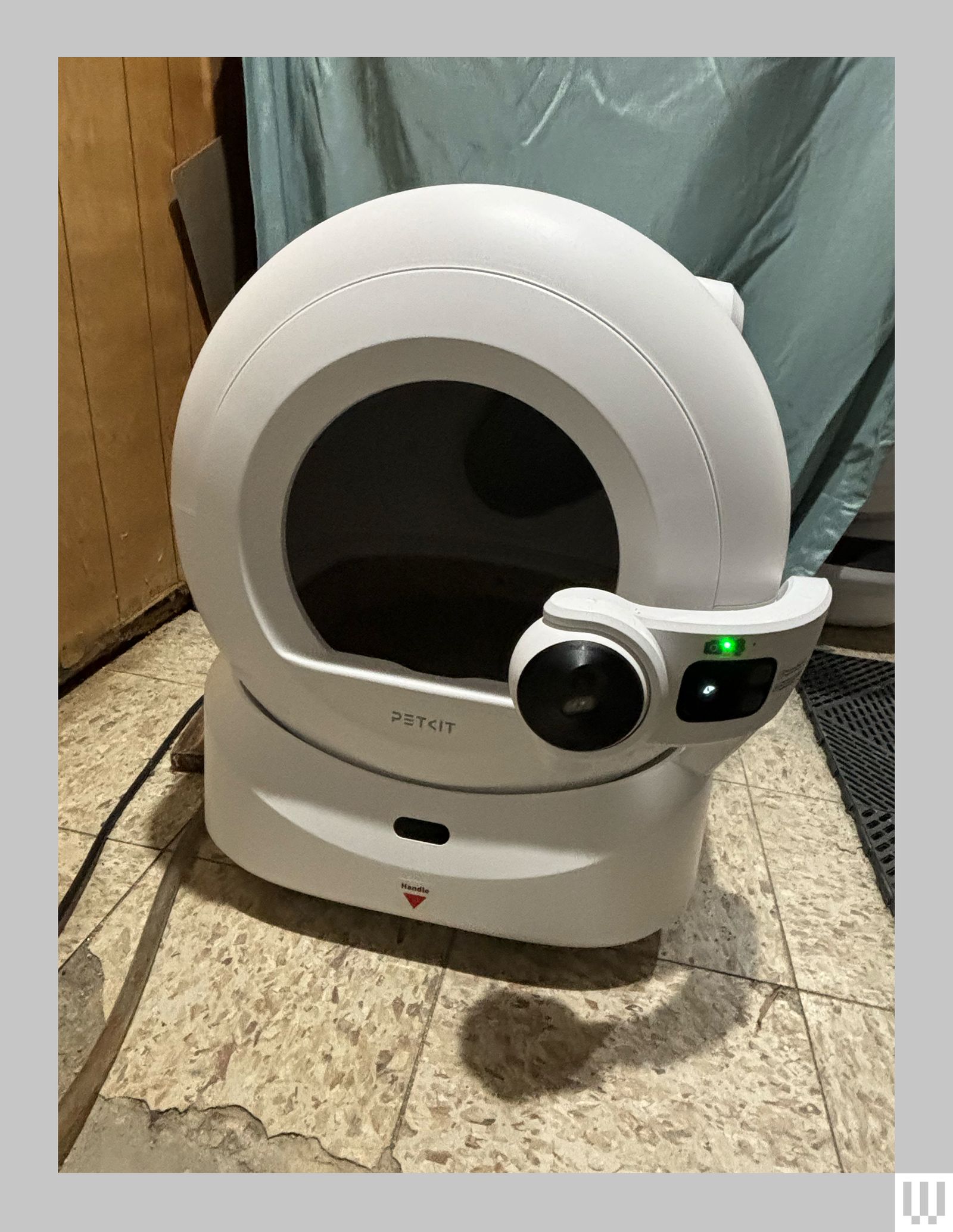 Front view of the Petkit Purobot Ultra Automatic Cat Litter Box a sphereshaped device with a circular opening and a...