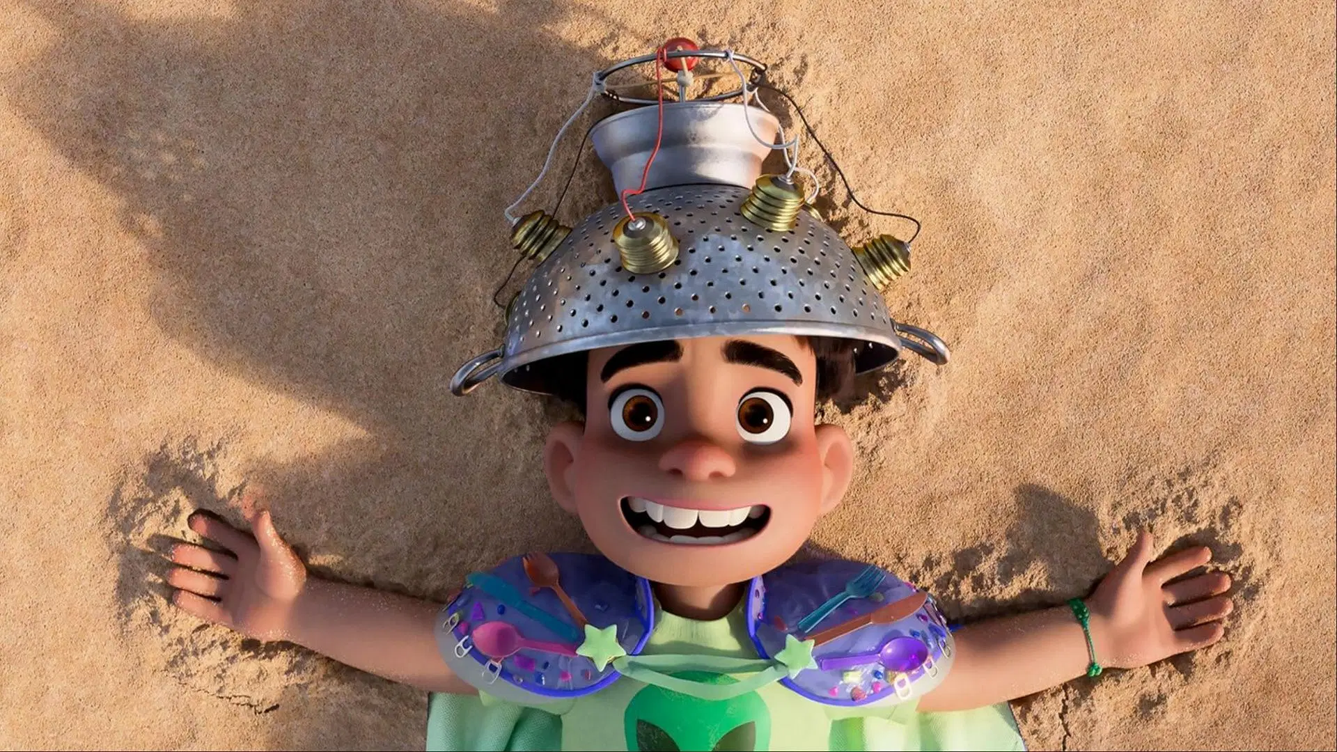 A still from the original vision of the character, where he wears a cape made from soda can tabs and plastic cutlery, a remnant of the “trash-ion show” sequence later removed from the final cut. (Image via Pixar)
