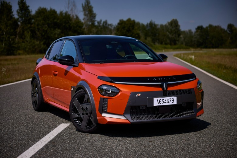 Front 3/4 view of an orange Lancia Ypsilon HF