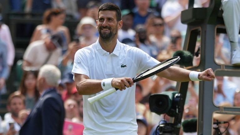 Novak Djokovic of Serbia reacts after beating Daniel Evans of Britain during their second round men's singles match at the Wimbledon Tennis 