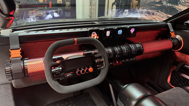 A wide shot of the Crater's dashboard showing the glowing orange crash bar and the full-width head-up display on