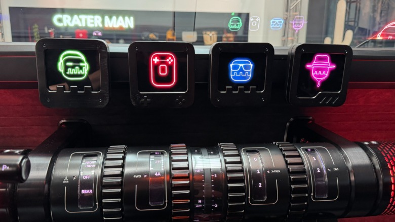A close-up of the four center-mounted screens and the barrel-style controls in the Crater Concept