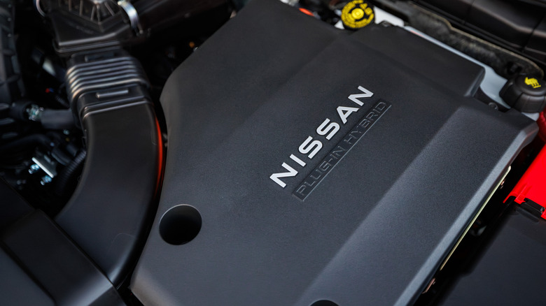 a photo under the Nissan Rogue PHEV's hood showing the engine cover