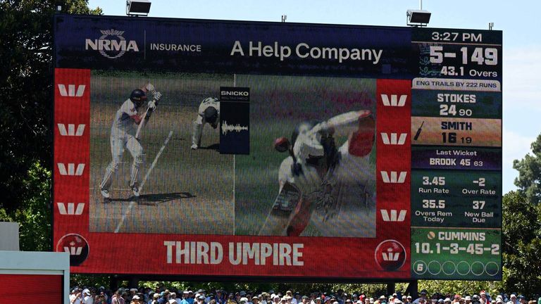 The big screen at the Adelaide Oval shows replays that led to the decision to give Jamie Smith out be overturned