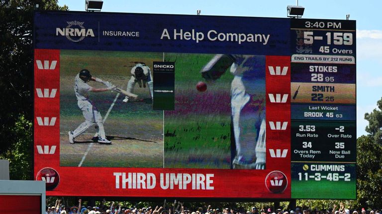 The big screen at the Adelaide Oval shows replays that led to Jamie Smith being given out by the third umpire