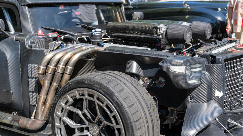 A modified car running a straight piped exhaust