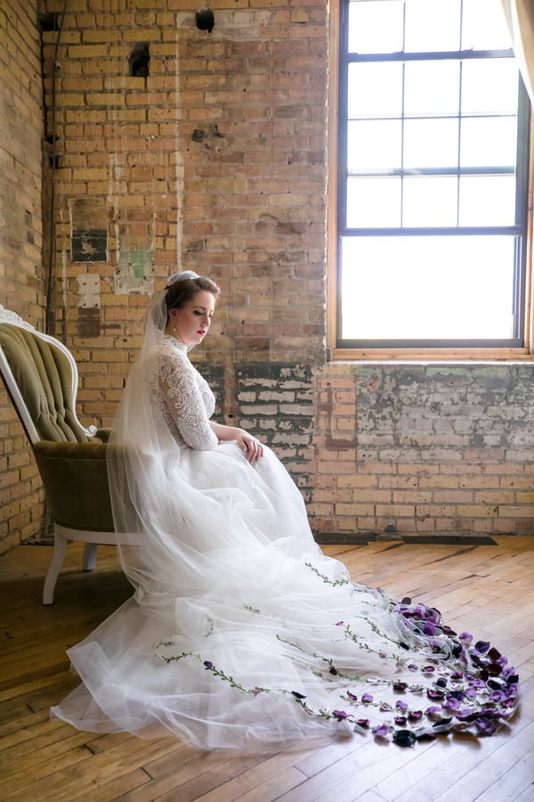 Bride Brittany in long-sleeve high-neck white lace A-line gown with vibrant cathedral veil at Minneapolis Institute of Art