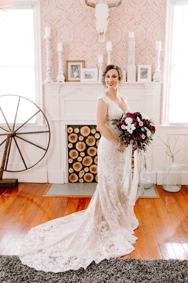 Bride Taylor in ivory lace fit-and-flare gown with scalloped edging and train at Hoody Hudson Farm in Georgia