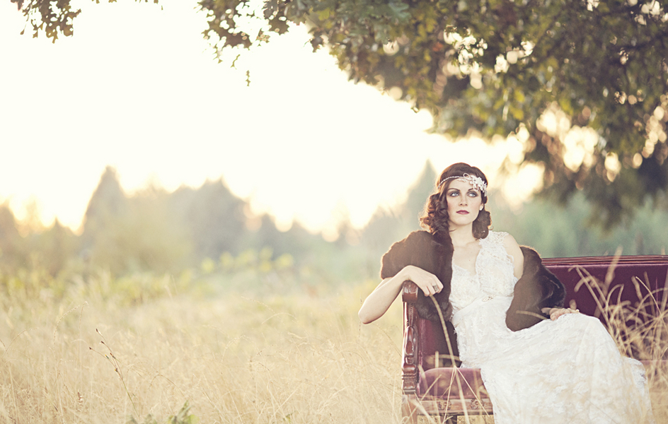 Bride in sleeveless v-neck white lace sheath gown at 1920s-inspired bridal ranch shoot with golden light