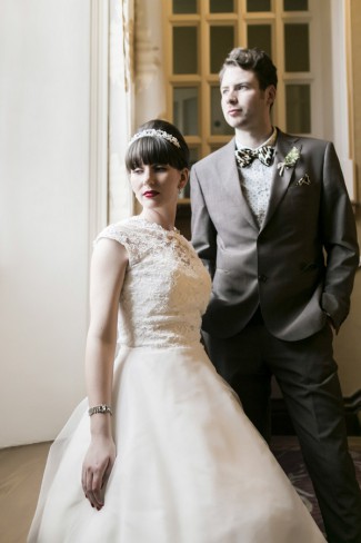 Amy and Sam at their 1960s-themed Wales wedding, bride in cap-sleeve white lace A-line dress with beehive hairstyle