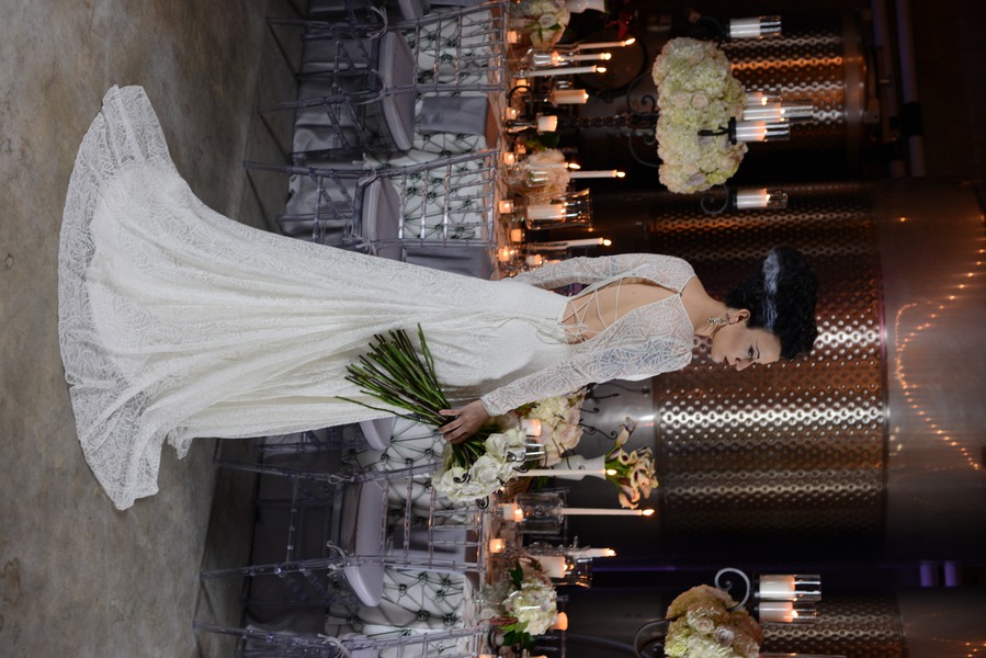 Bride in long-sleeve v-neck white gothic lace sheath gown at Bride of Frankenstein Halloween styled shoot at Quantum Leap Winery, Orlando