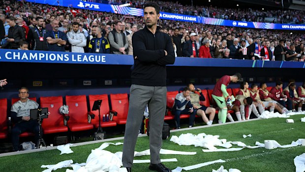Mikel Arteta looks on surrounded by toilet roll.