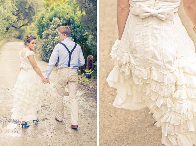 Couple walking hand in hand down a garden path, the bride looking back over her shoulder