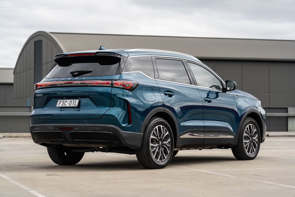 A teal 2026 Chery Tiggo 7 Super Hybrid SUV seen from the rear three-quarter angle in a car park